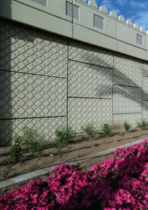 Patterned GFRC architectural screen in a landscape setting