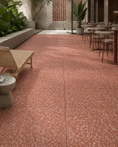 Rose-toned terrazzo concrete outdoor patio with seating